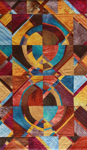 Image of quilt titled “Hubble to Earth" by Louise Harris